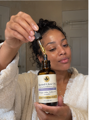 Rooted Glow oil pressed into skin during a nighttime self-care ritual